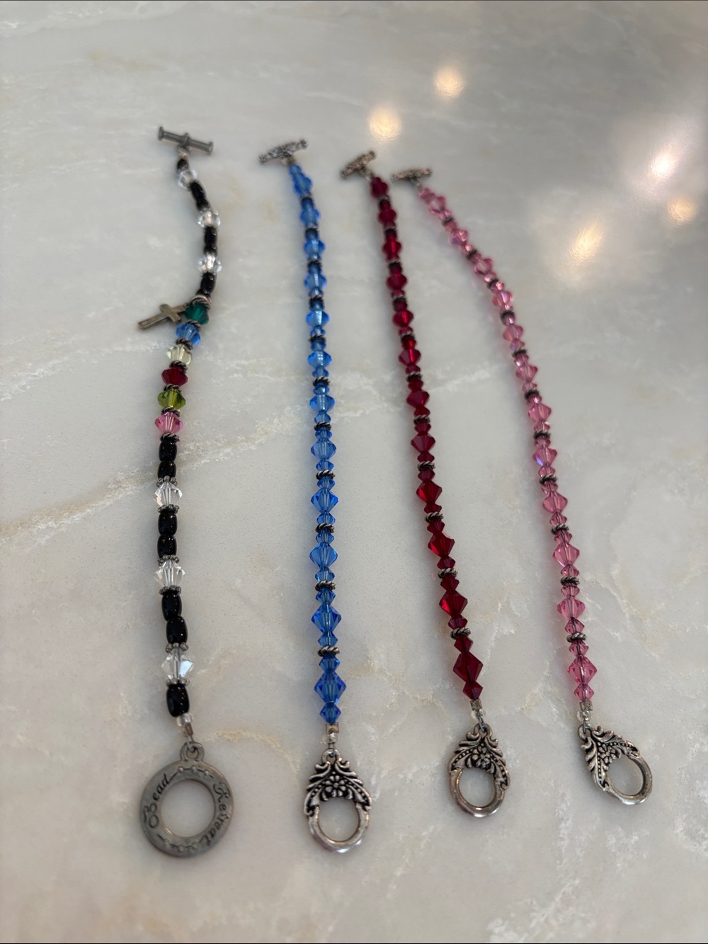 Four Swarovski Crystal Bracelets with Decorative Toggle (Pink, Red, Blue, Black)
